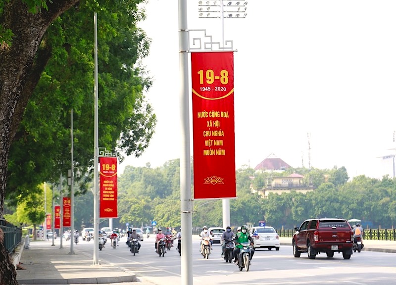 Red flags and banners color Hanoi on National Day