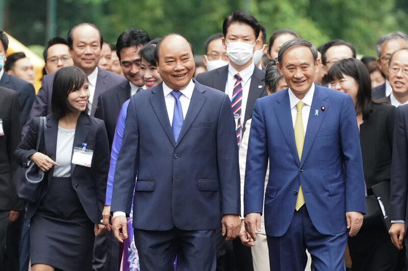 Vietnam accords red carpet welcome to Japan PM Suga