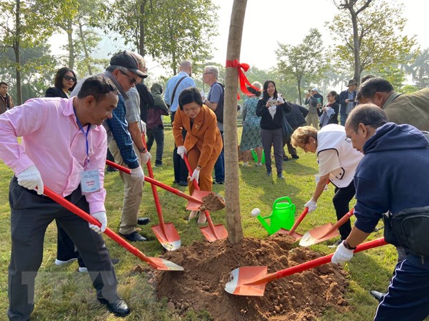 International delegates join tree-planting event to celebrate the Paris Peace Accords