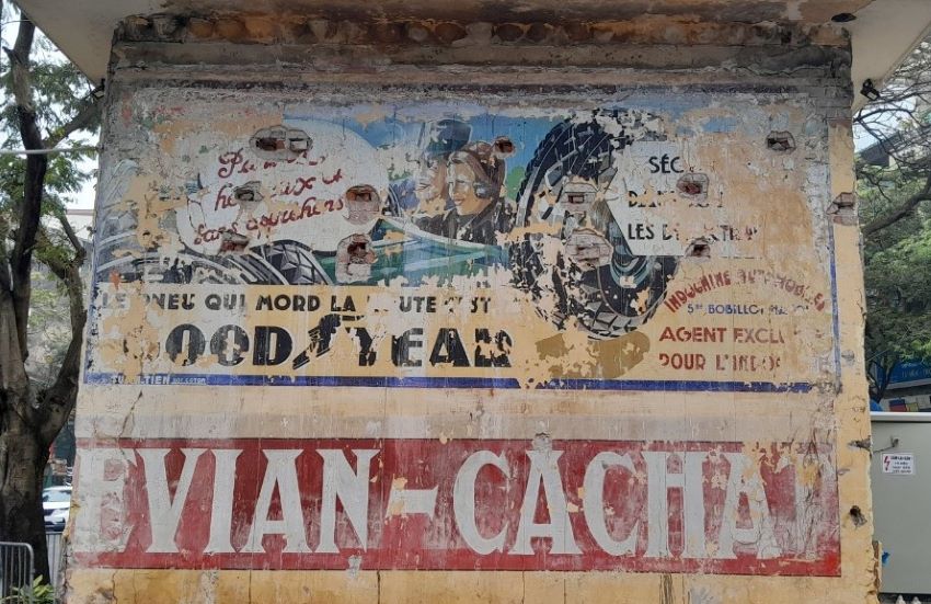 Colonial-era French ad posters preserved on Hanoi street