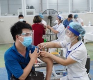 Vietnam reports more Covid-19 infections, big cities urge vaccine booster shots