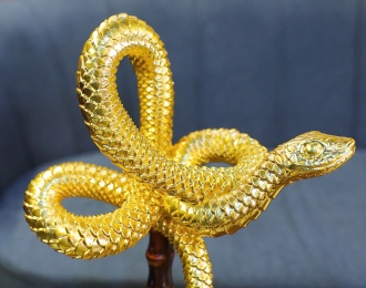 A glimpse of the 24K gold Lunar New Year 2025 Snake Mascot