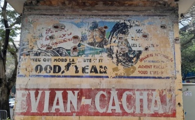 Colonial-era French ad posters preserved on Hanoi street